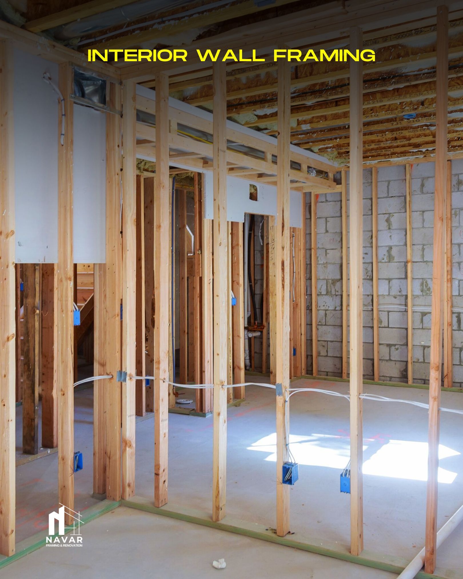 Installation of interior partition wall studs in a residential remodel.